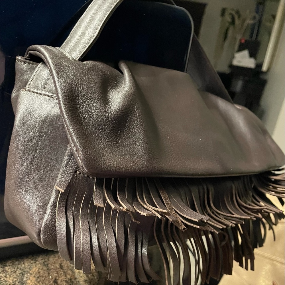 Beautiful purse all leather size 12X7 colour brown!  Never use!!!